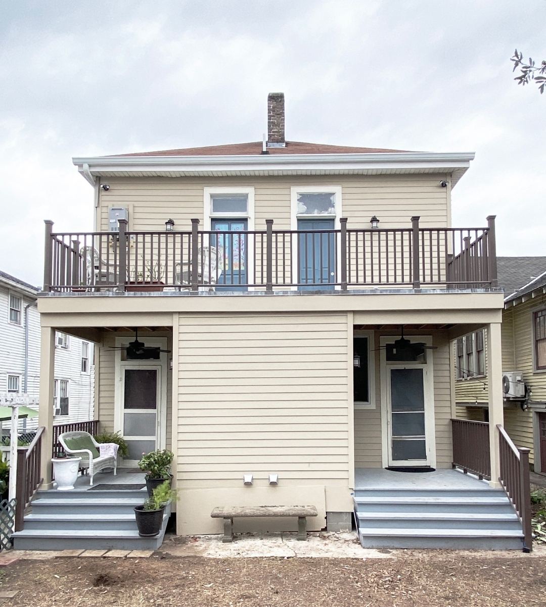 After — completed rear addition with upper deck and railings