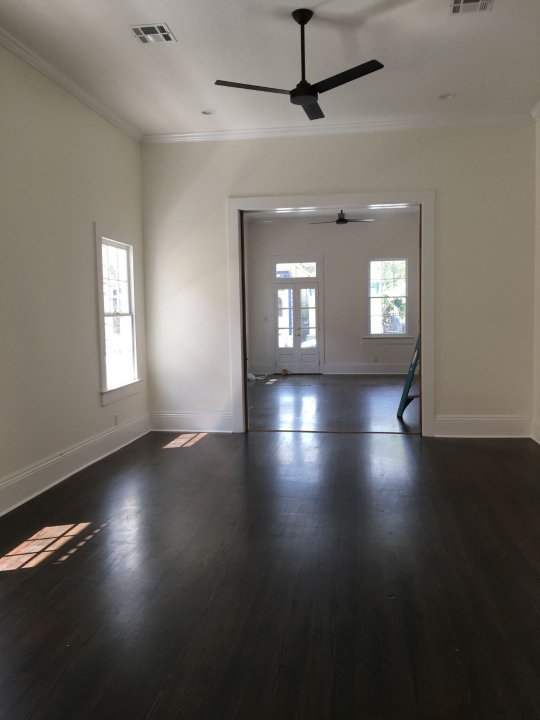 Blue subway tile shower with marble bench seat and penny tile floor