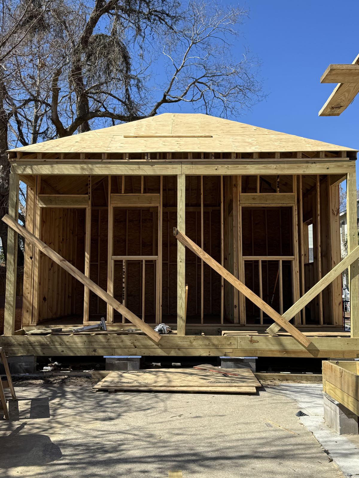 Large marble tile walk-in shower with hex dot pattern floor