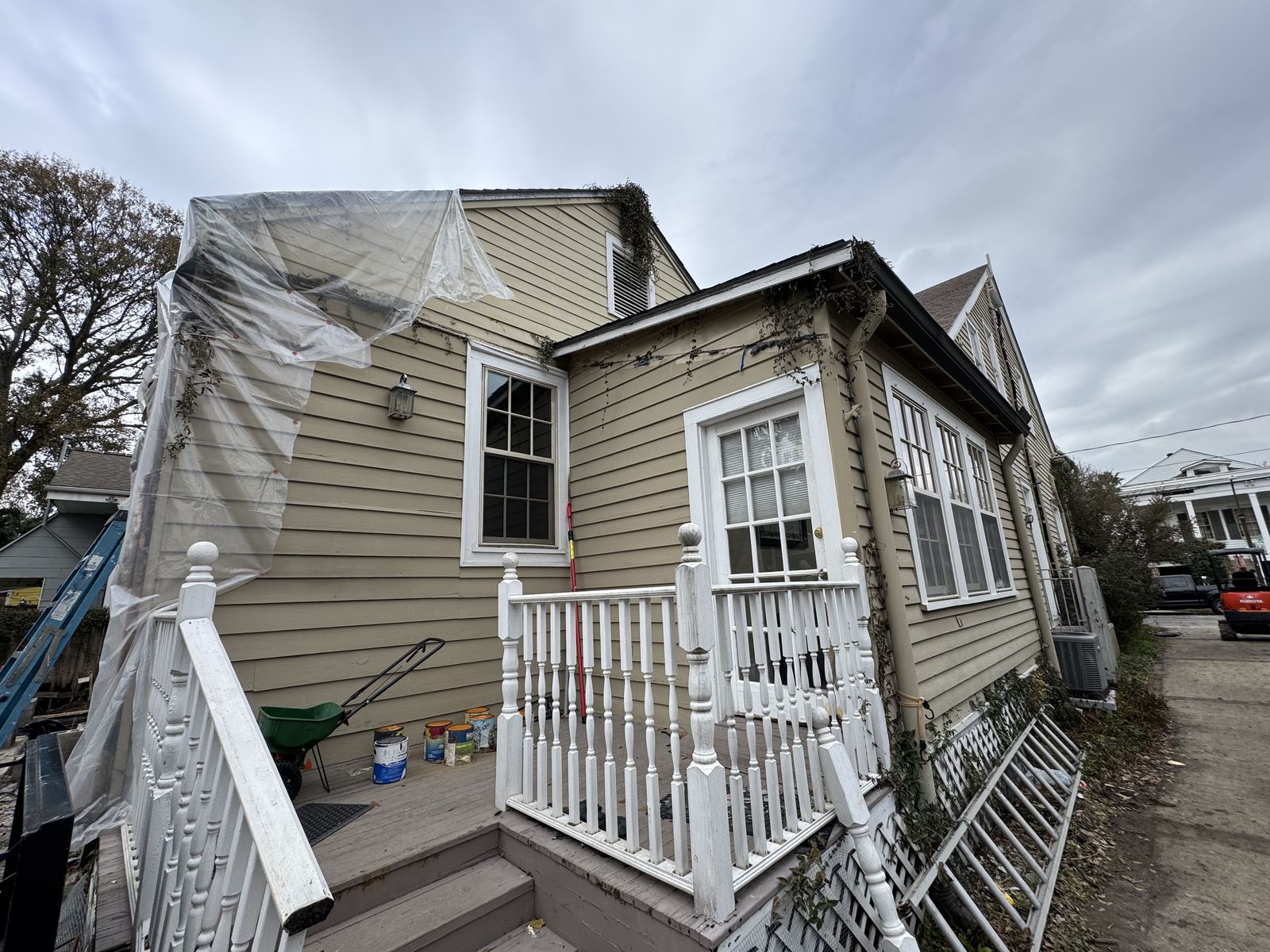 White herringbone tub and shower combo with matte black square rain head and niche