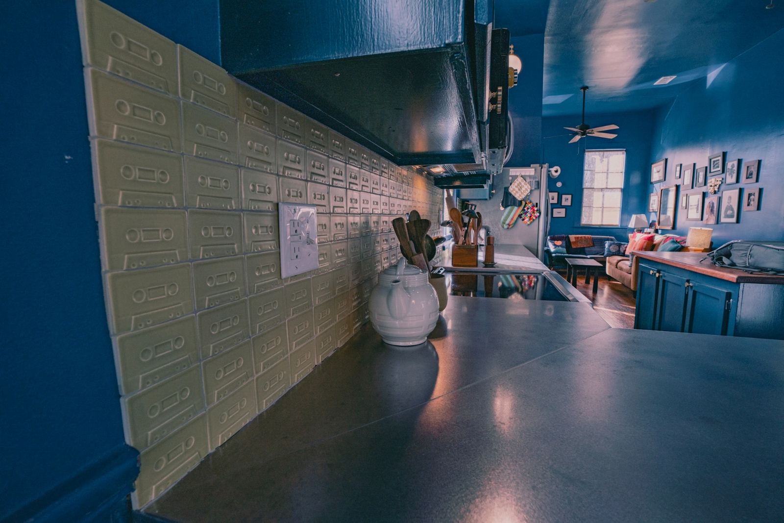 White shower with brass grab bars and gold fixtures — ADA accessible design
