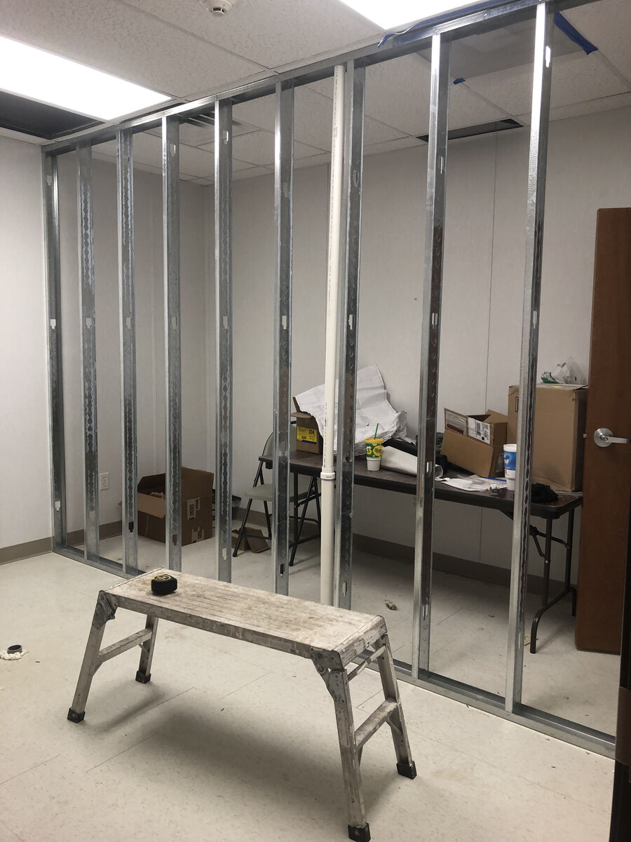 Commercial office metal stud partition framing — interior build-out in progress