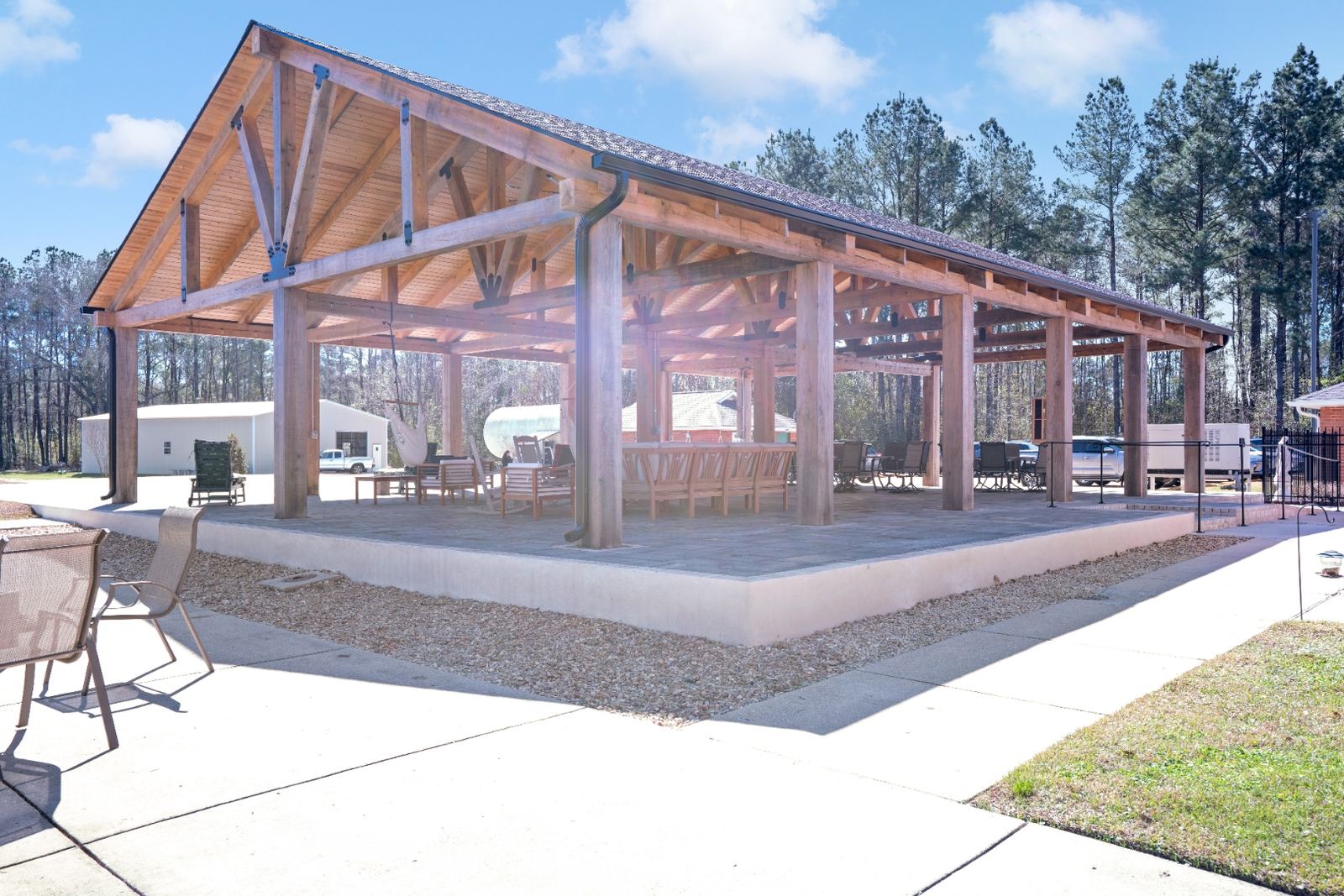 Pavilion interior with lake views and timber truss ceiling