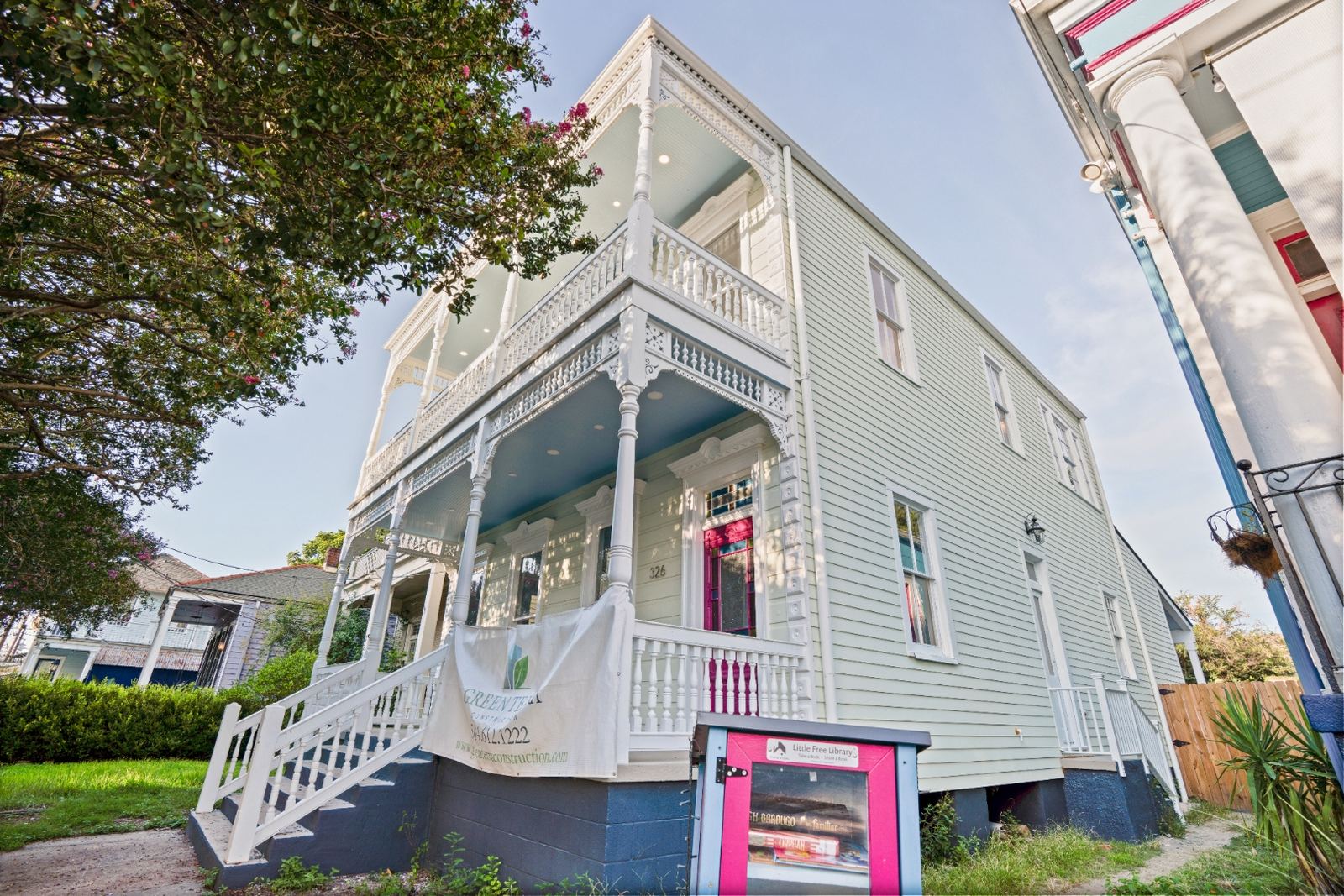 Restored grand staircase interior with original newel post and balusters