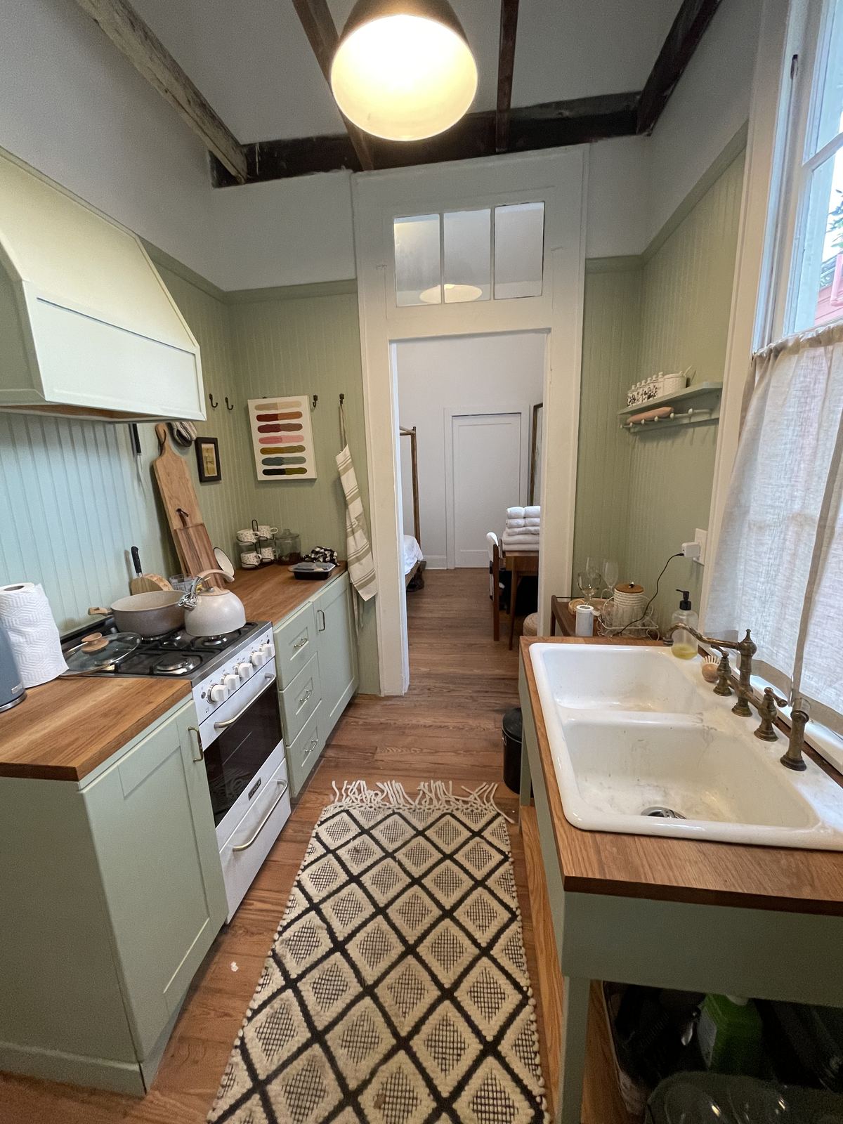 Sage green shotgun kitchen