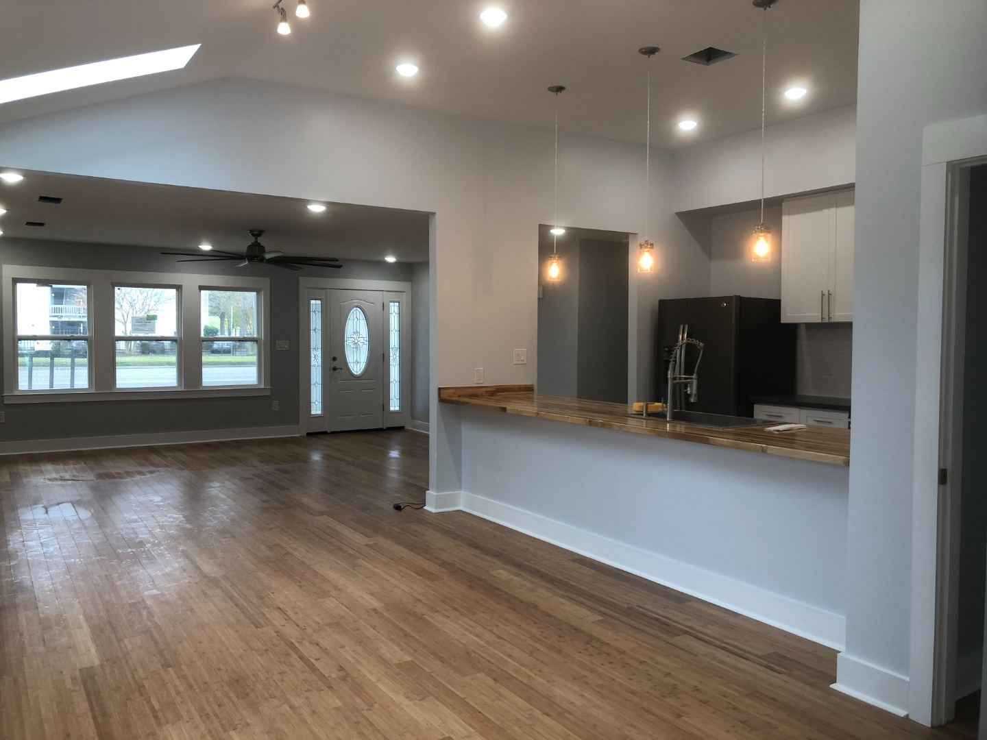 Open-plan living room and kitchen after renovation