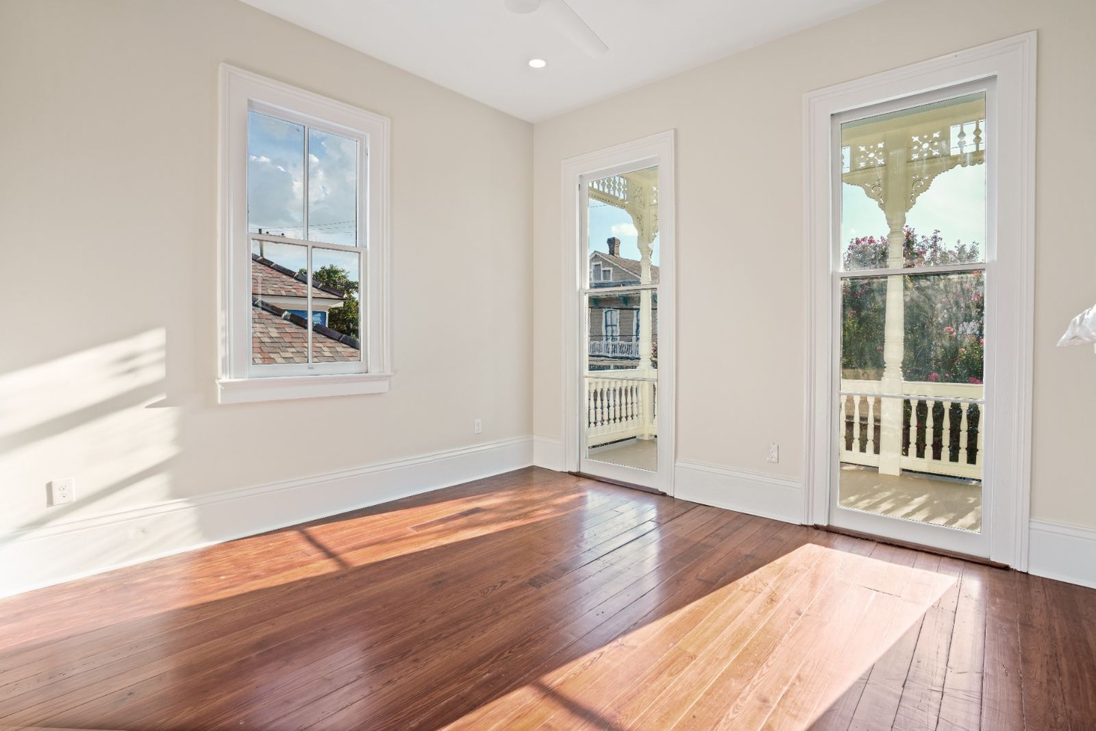 Bedroom with French doors opening to upper porch