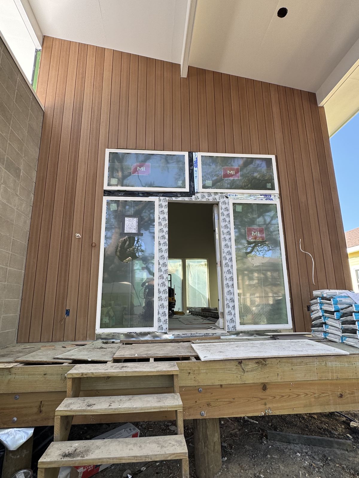 Completed rear addition double shotgun with upper deck and covered porches