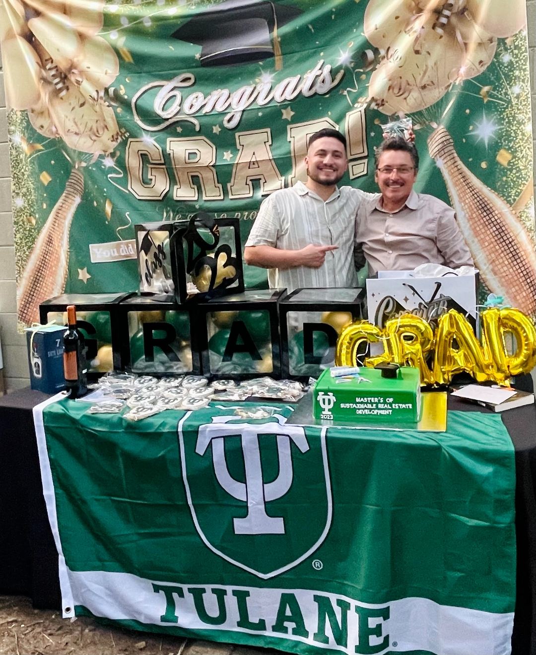 Rey Rivas and Esteban Rivas celebrating Tulane Master's graduation