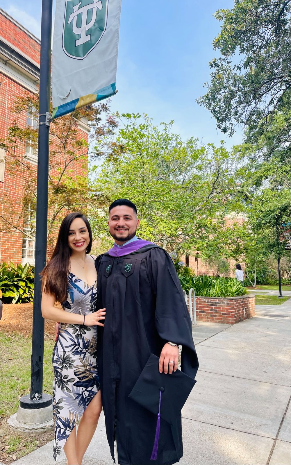 Rey Rivas with his wife at Tulane University graduation — Master of Sustainable Real Estate Development